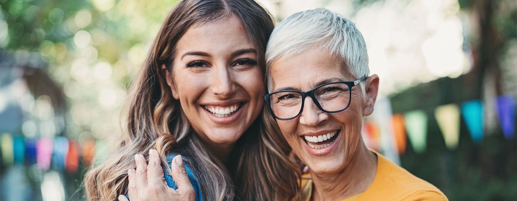 an adult child and mom embracing