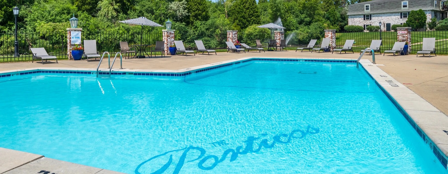 a pool with chairs around it